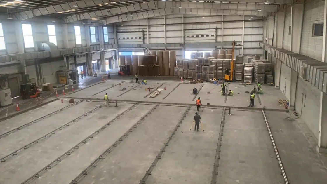 Large industrial interior with ceiling-level ventilation and services