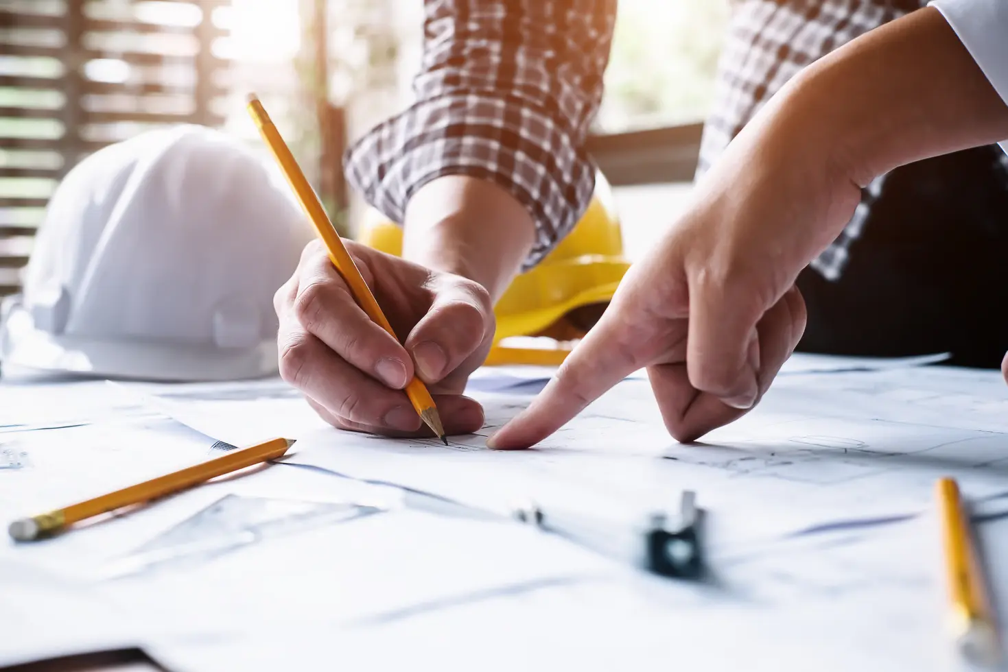Project planning desk with drawings, notes and measurement tools